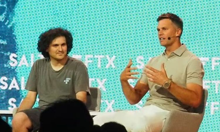 Vivian Lake Brady's father, Tom Brady, with now jailed FTX founder Sam Bankman-Fried. 